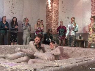 Curvy brunette with a nice ass mud-wrestling another girl