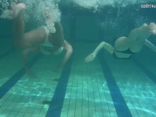 Two foxy lassies have some kinky fun under the water