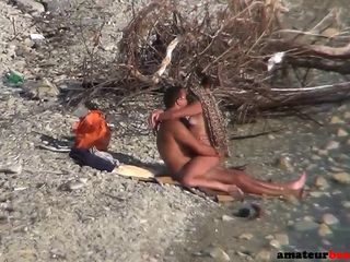 Horny nudist couple caught on voyeur camera while enjoying a beach fuck in public, girlfriend riding hard cock and enjoying a ni